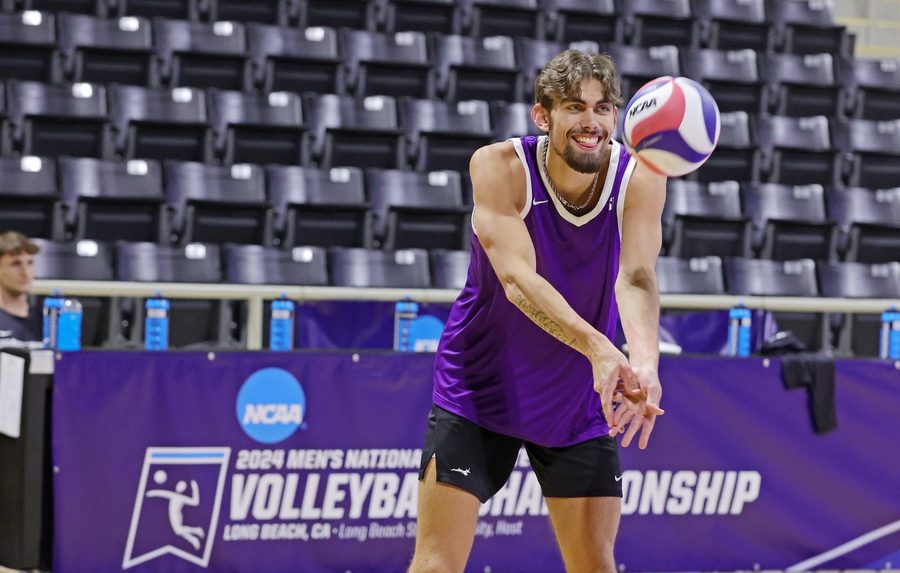 Volleyball player passing a ball on an indoor court