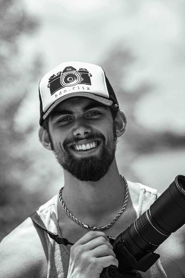 Nick Bentlage in a bdn.flix cap holding a camera